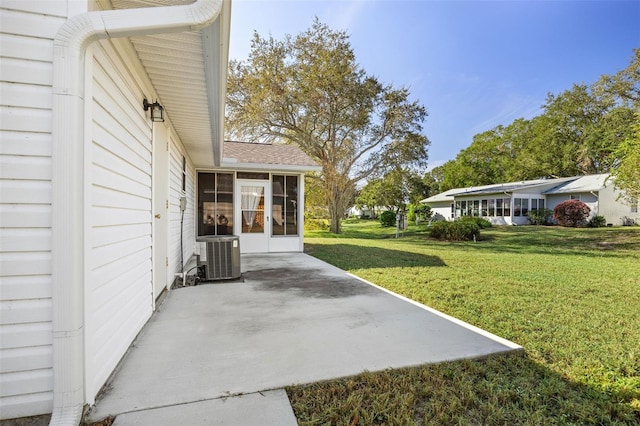 view of yard with a patio, cooling unit, and a sunroom