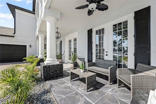 view of patio with ceiling fan, a garage, an outdoor living space, and french doors