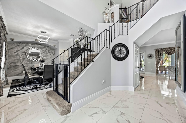 stairway featuring an inviting chandelier and ornamental molding