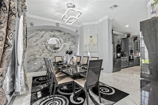 dining room with crown molding