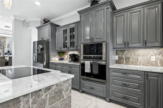 kitchen with fridge with ice dispenser, black electric cooktop, gray cabinetry, and ornamental molding