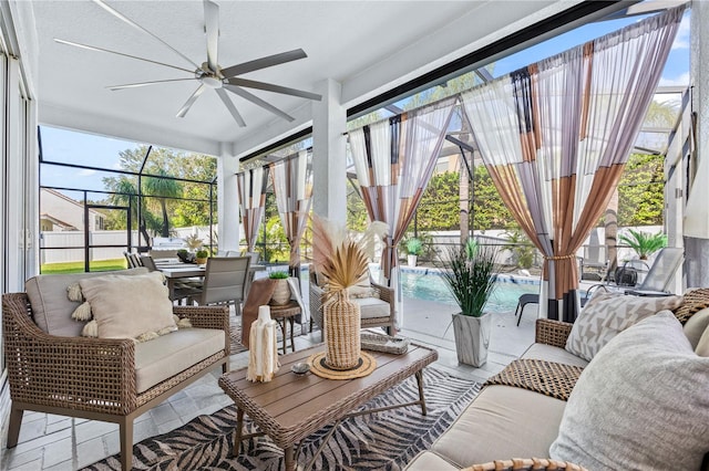 sunroom / solarium featuring ceiling fan and a healthy amount of sunlight