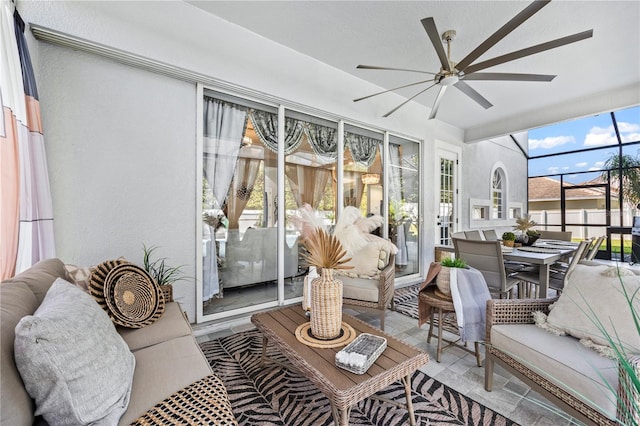 sunroom / solarium with plenty of natural light and ceiling fan