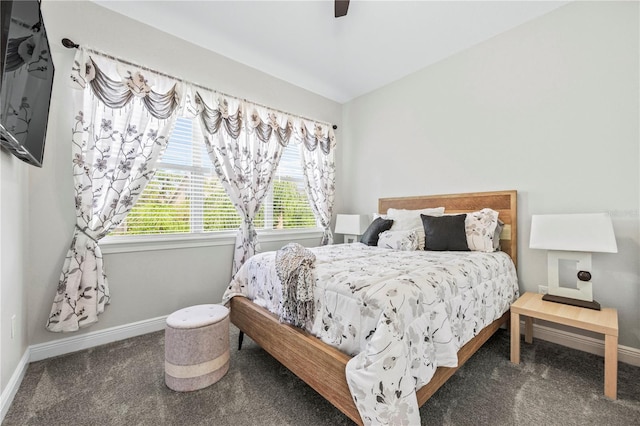 bedroom featuring dark carpet and ceiling fan