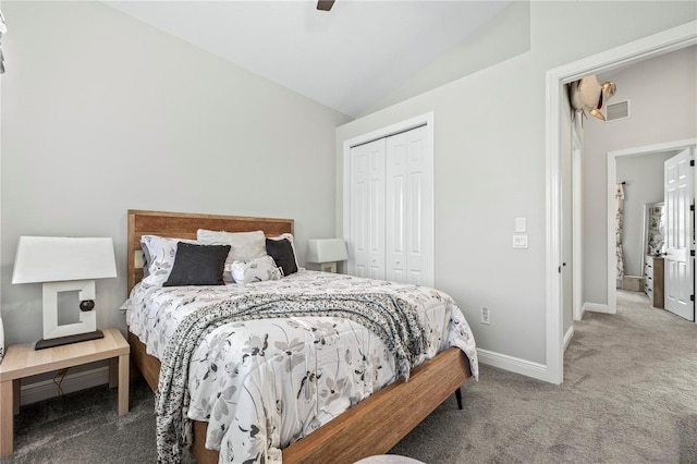 carpeted bedroom featuring ceiling fan, lofted ceiling, and a closet