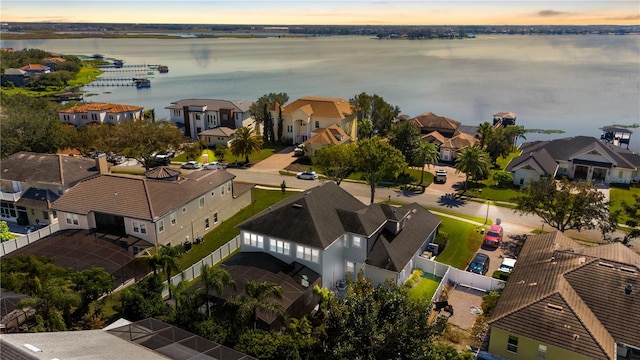 aerial view at dusk with a water view