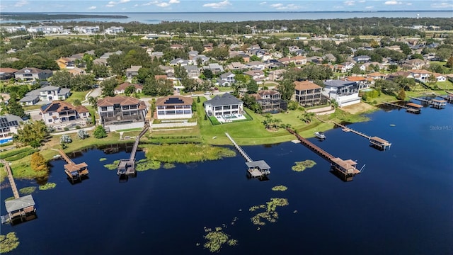 drone / aerial view with a water view