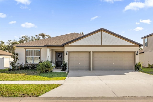 ranch-style house with a front yard and a garage