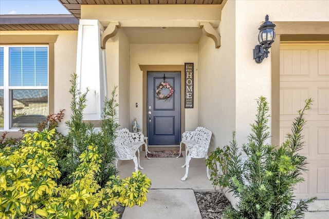 doorway to property with a garage