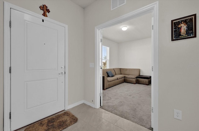 view of carpeted foyer