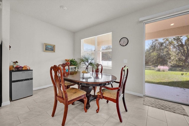 dining space with light tile patterned floors