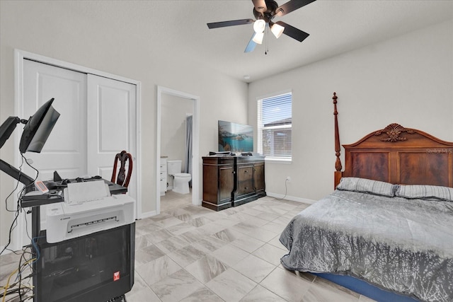 bedroom featuring a closet, ceiling fan, and ensuite bath