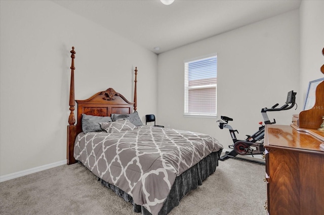 bedroom featuring light carpet