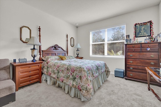 bedroom featuring light carpet