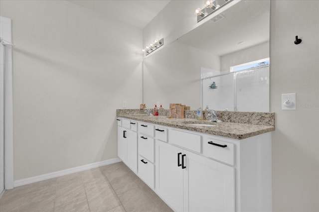 bathroom featuring vanity, walk in shower, and tile patterned flooring