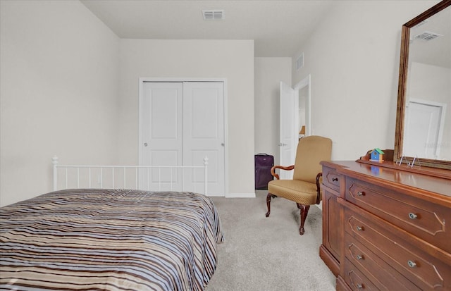 bedroom featuring light carpet and a closet