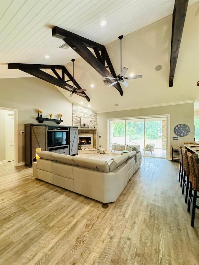 living room with beam ceiling, wooden ceiling, light wood-type flooring, high vaulted ceiling, and ceiling fan