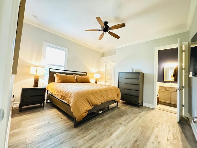 bedroom featuring light hardwood / wood-style flooring, ceiling fan, connected bathroom, and crown molding