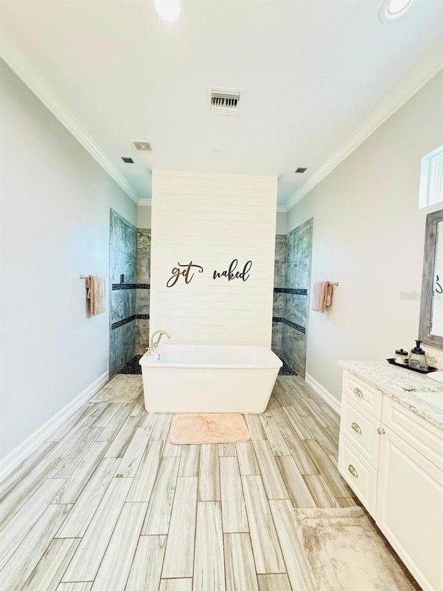 bathroom with vanity, crown molding, hardwood / wood-style floors, and separate shower and tub