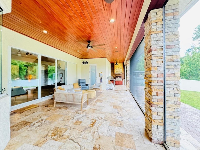 view of patio featuring ceiling fan and an outdoor living space