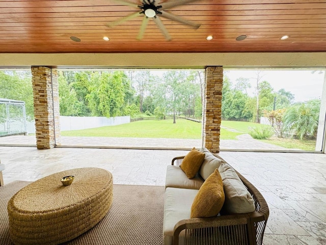 doorway featuring wood ceiling, a healthy amount of sunlight, and ceiling fan