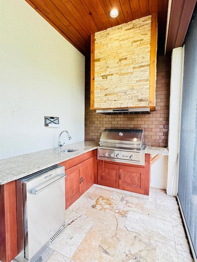 view of patio / terrace with exterior kitchen, sink, and grilling area