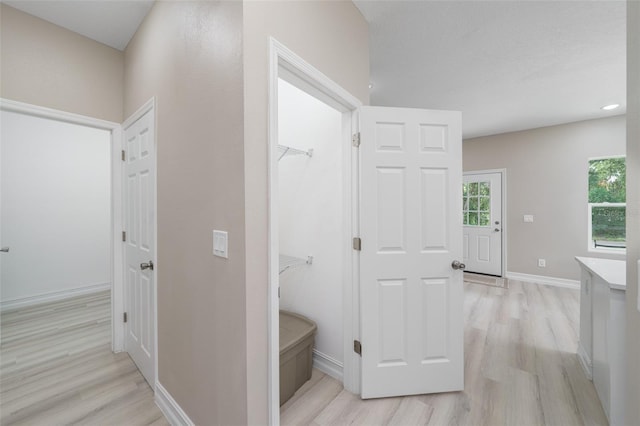 hallway featuring light hardwood / wood-style flooring