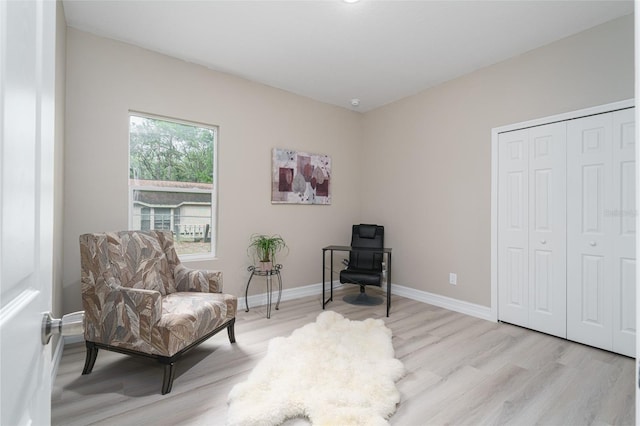 sitting room with light hardwood / wood-style floors