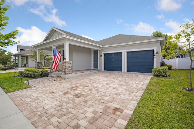 view of front of house featuring a garage and a front yard