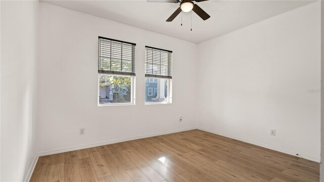 unfurnished room with wood-type flooring and ceiling fan