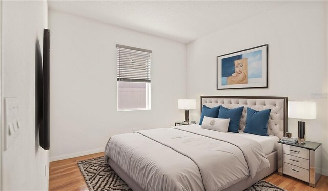 bedroom with light hardwood / wood-style floors