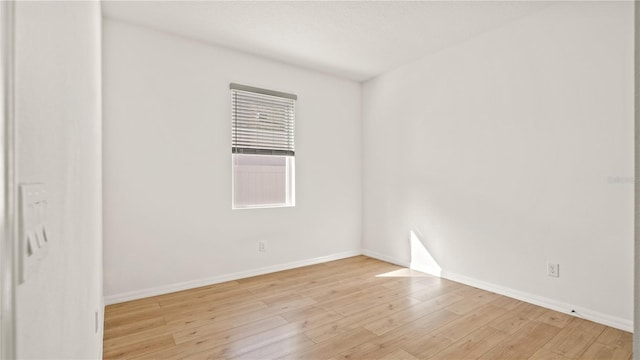 spare room with light wood-type flooring