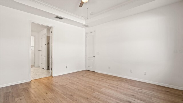 empty room featuring ceiling fan and light wood-type flooring