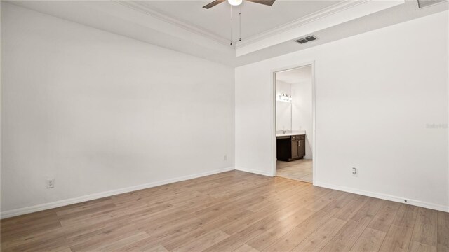 empty room featuring ornamental molding, light hardwood / wood-style floors, and ceiling fan