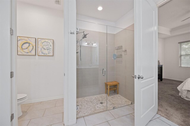 bathroom with walk in shower, tile patterned flooring, ornamental molding, and toilet