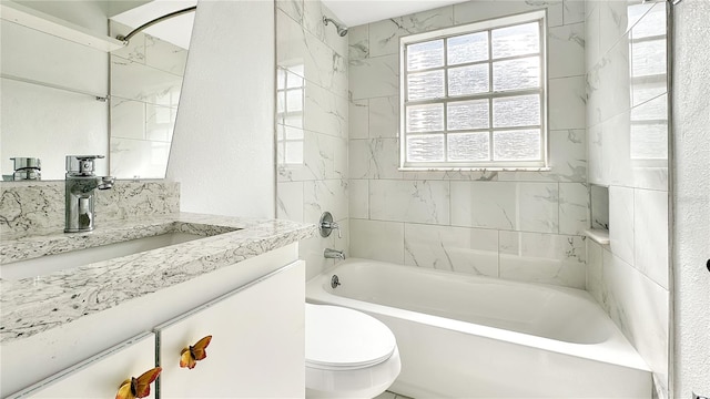 full bathroom featuring vanity, toilet, and tiled shower / bath combo