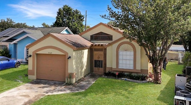 view of front of house featuring a garage and a front lawn