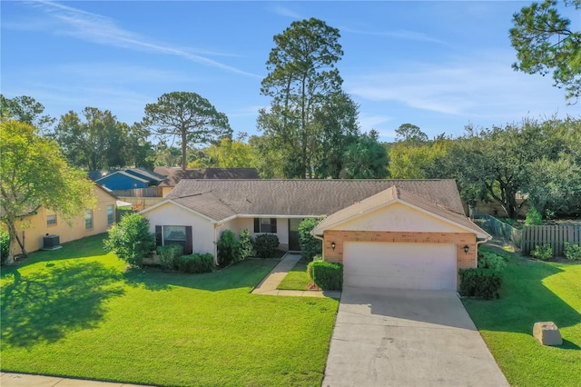 single story home with a garage and a front lawn