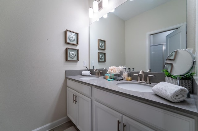 bathroom featuring vanity and walk in shower