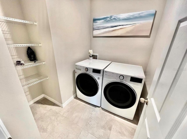 washroom featuring washing machine and dryer