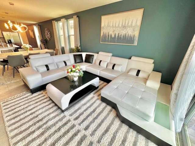 tiled living room with a chandelier