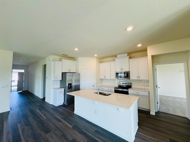 kitchen featuring a sink, dark wood-type flooring, white cabinets, and stainless steel appliances