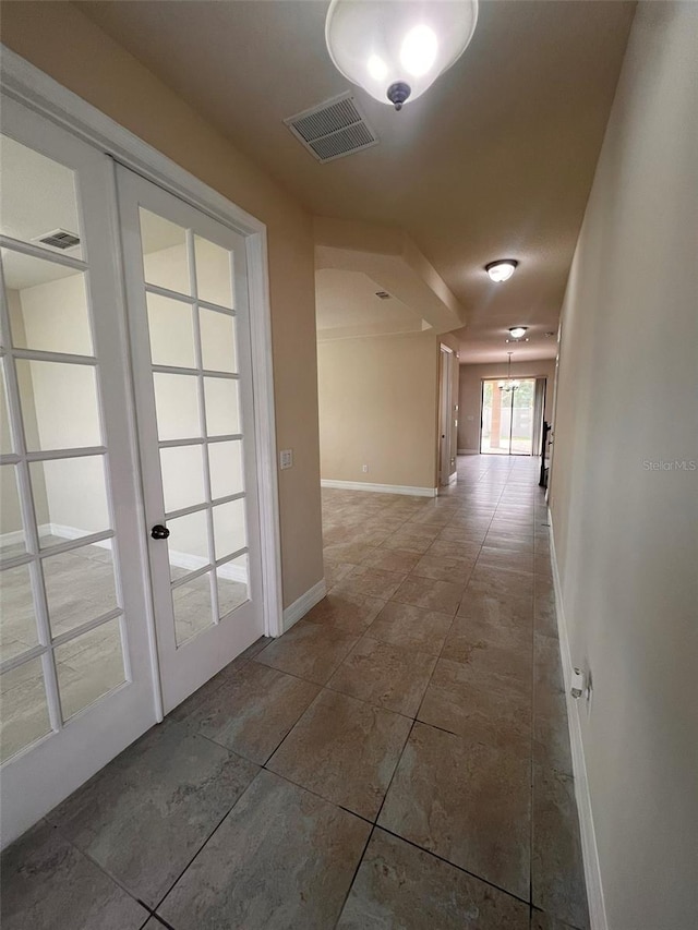 corridor featuring french doors