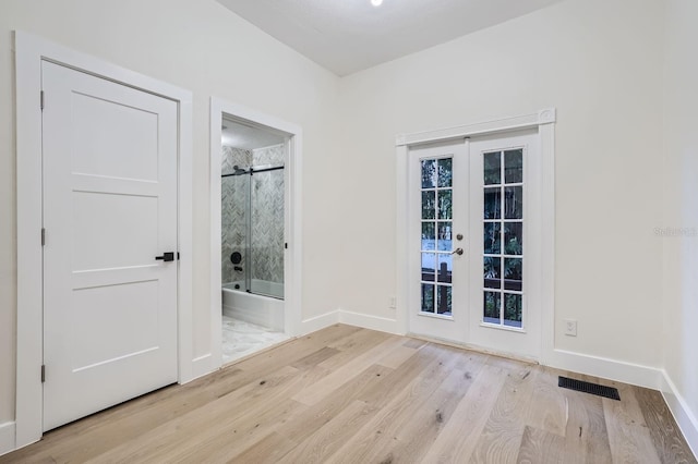734 S Mills Ave, Orlando, FL 32801 - empty room featuring baseboards, visible vents, french doors, and wood finished floors