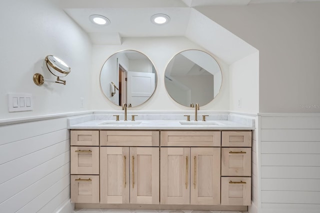 734 S Mills Ave, Orlando, FL 32801 - bathroom featuring double vanity, wainscoting, and a sink