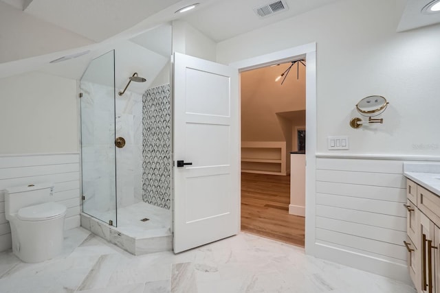 bathroom with vanity, hardwood / wood-style floors, toilet, and a shower with door