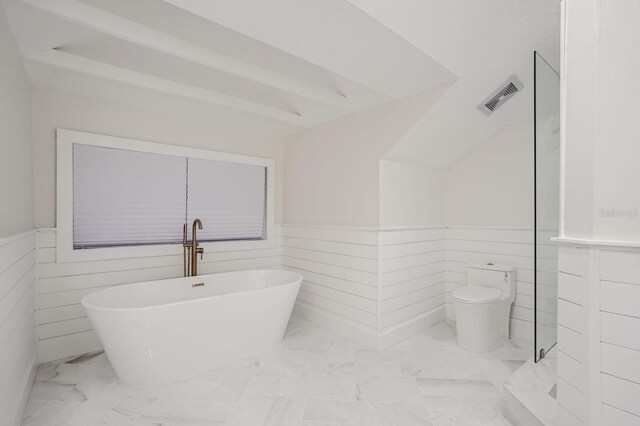 734 S Mills Ave, Orlando, FL 32801 - full bathroom featuring visible vents, marble finish floor, wainscoting, toilet, and a soaking tub