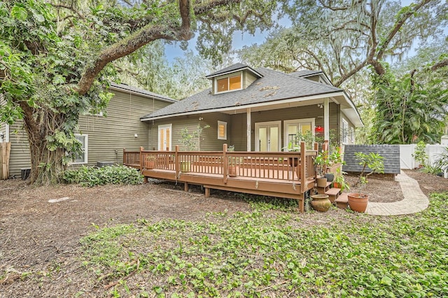 back of property featuring a wooden deck