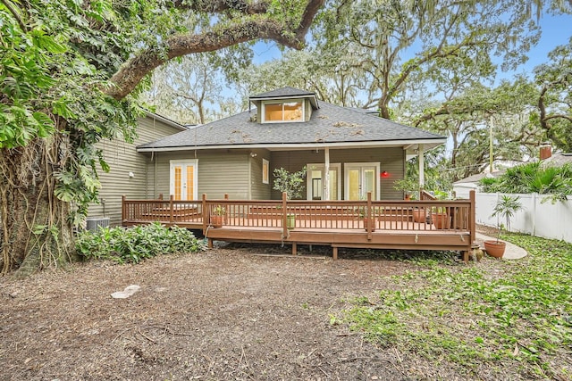 rear view of house with a wooden deck