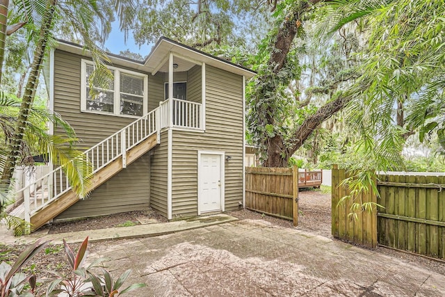 734 S Mills Ave, Orlando, FL 32801 - rear view of property featuring stairway, a patio, and fence